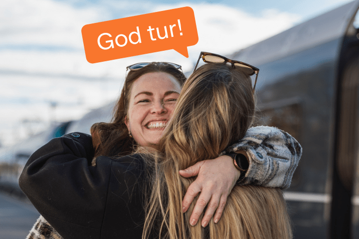 Avskjedsklem før reise med god tur i snakkeboble